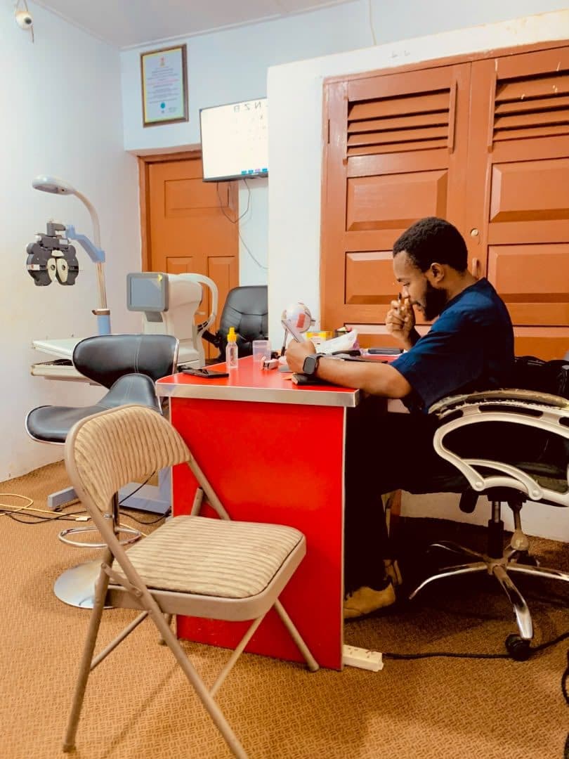 The examination room at God First with a phoropter and diagnostic equipment