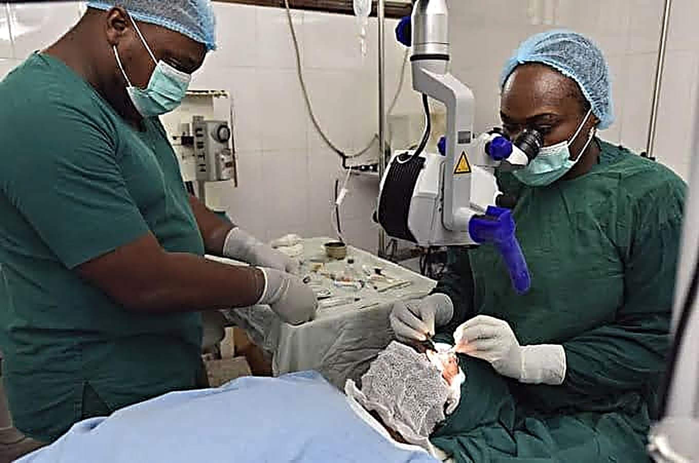 Two God First eye surgeons operating together at the surgical microscope